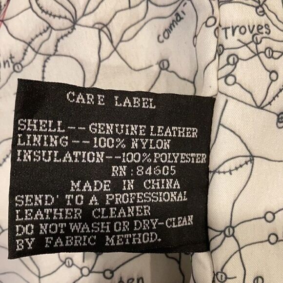 Burks Bay  leather brown coat has a patch on the left side. - Picture 5 of 8